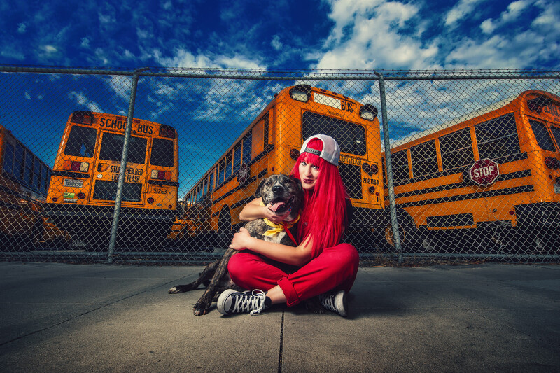 Woman sitting on floor with dog.