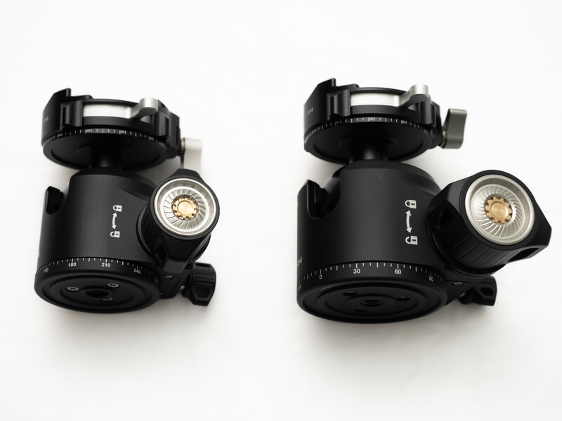Two black tripod ball heads with spirit levels shown from different angles.