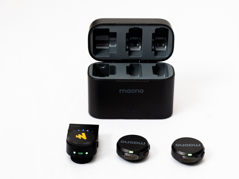 Moono wireless microphone system with charging case and three capsule modules displayed.