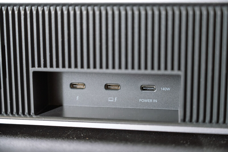 Close-up of device connectivity ports showing two USB-C connectors, one USB-A port, and a 140W power input jack.