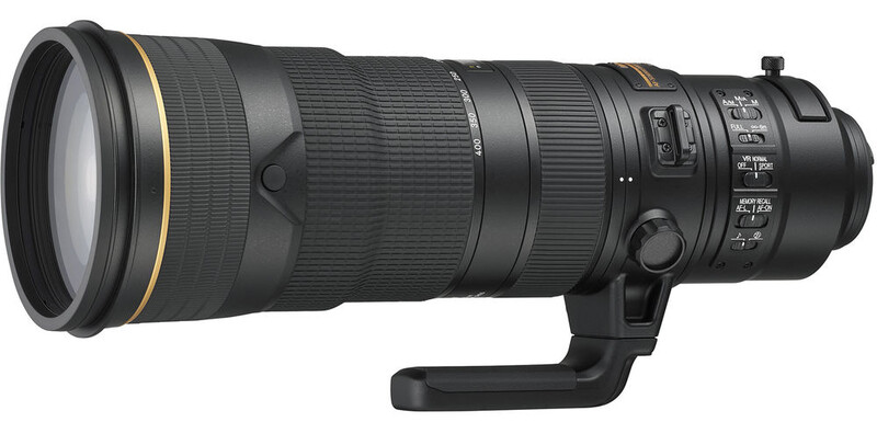 Professional telephoto lens with gold accents and integrated tripod collar on black background.