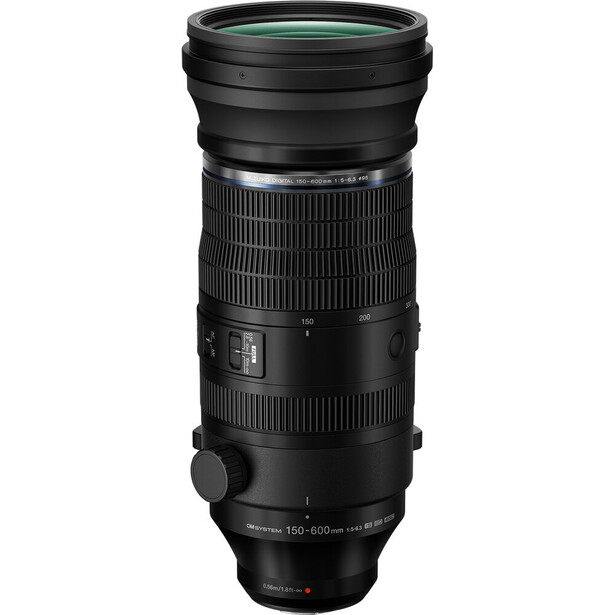 Black telephoto lens with textured grip section and green-tinted front element against white background.