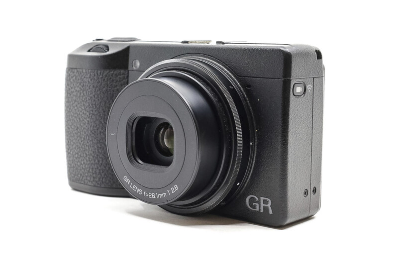 Ricoh GR compact digital camera with fixed lens, displayed against white background.