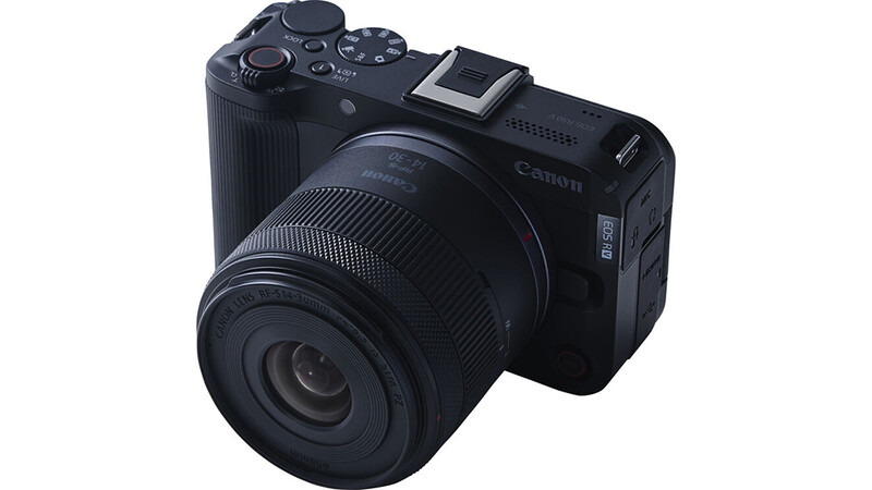 Canon EOS R50 mirrorless camera with RF-mount lens attached, shown against a white background.