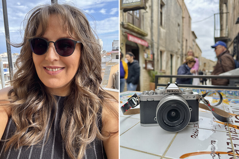 Photographer wearing sunglasses smiling outdoors with urban buildings behind her.