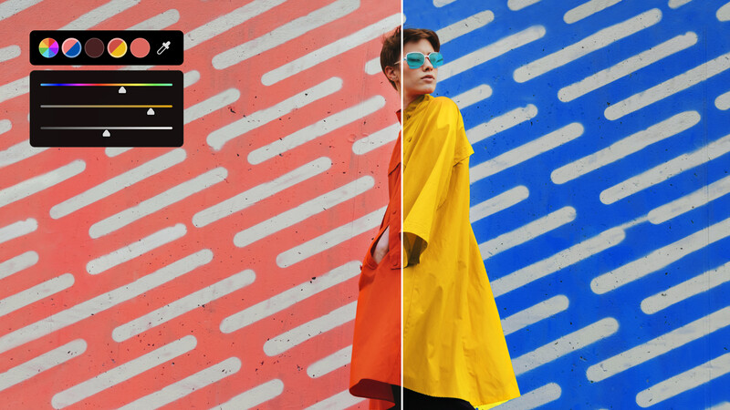 Person in yellow shirt against split red and blue wall with geometric stripe patterns.