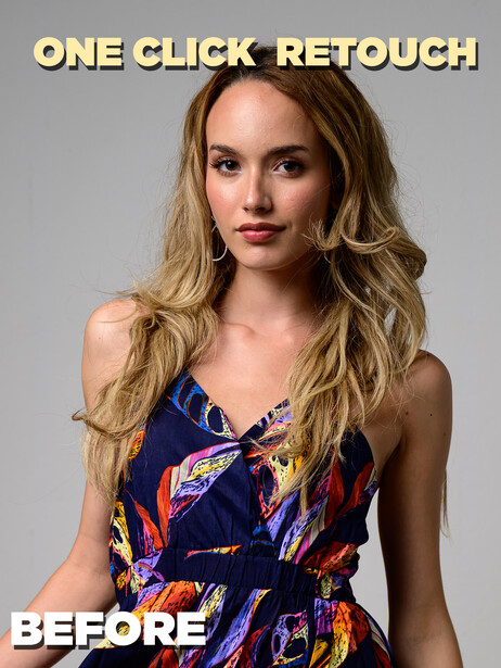 Portrait of a woman with long, wavy blonde hair wearing a dark blue floral dress against a neutral background.
