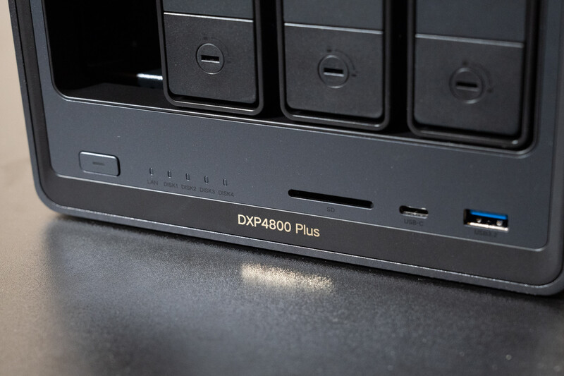 Front panel of a DXP4800 Plus NAS device showing three drive bays, LED indicators, and a USB 3.0 port.