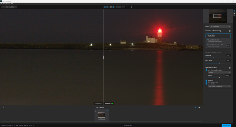 Screenshot of photo editing software showing a nighttime landscape with a bright red light beacon.