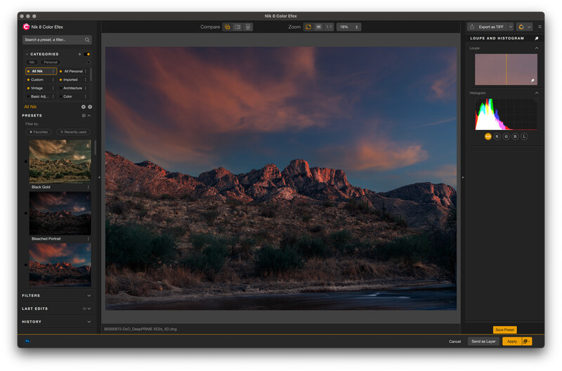 Screenshot of photo editing software displaying a desert landscape with red rock formations at sunset.