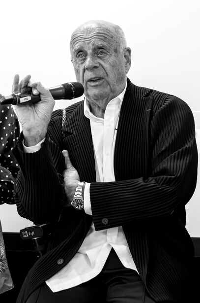 Ralph Gibson talking on a microphone
