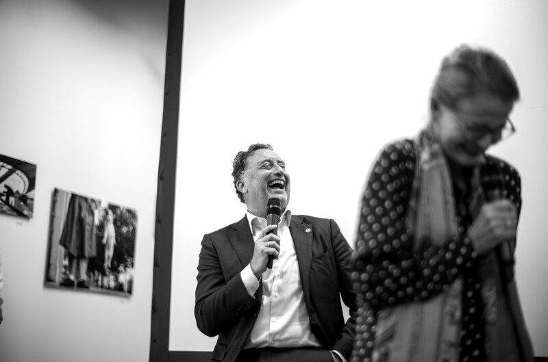 Matthias Harsch (CEO) laughing and holding a microphone