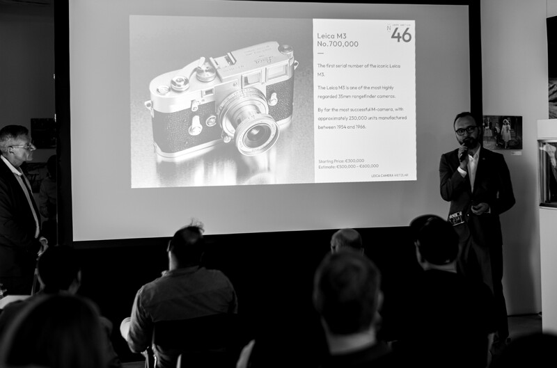 Presentation slide displaying a vintage Leica M3 rangefinder camera with pricing information and specifications.