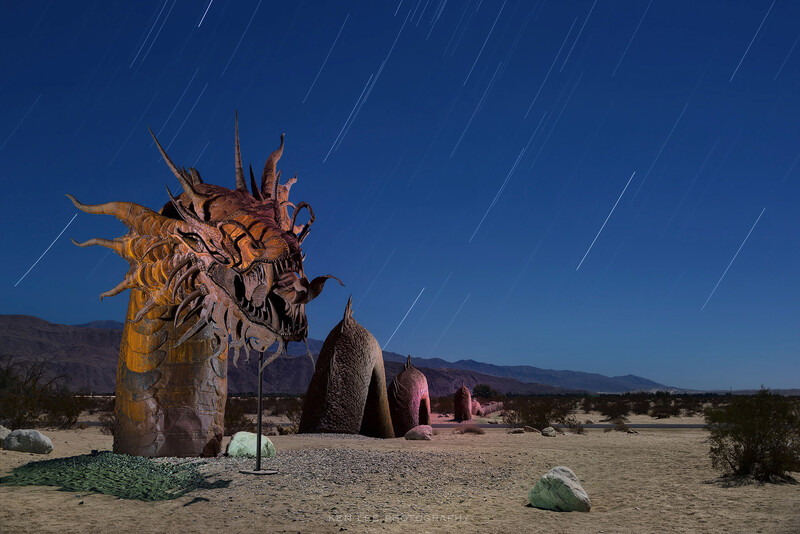 Night photo of giant sculpture in Borrego Springs with star trails.