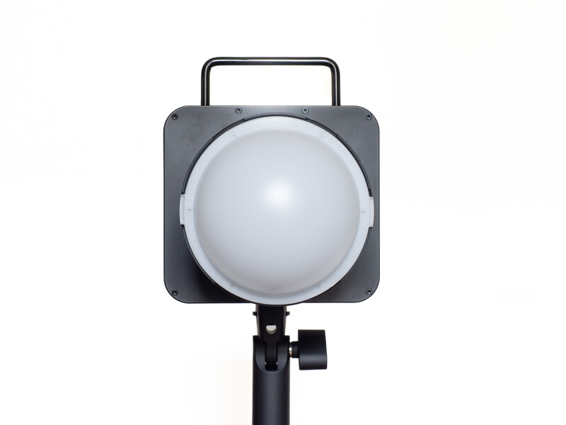Square LED studio light with diffusion dome mounted on adjustable stand.