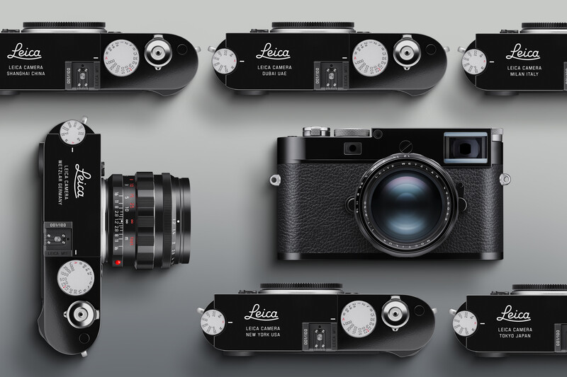 Collection of Leica rangefinder cameras displayed from above on gray background.