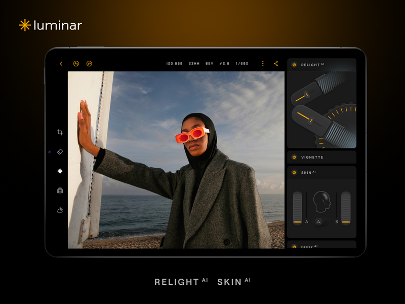 Screenshot of Luminar photo editing software showing a portrait of a person wearing red-tinted sunglasses by the ocean, with editing panels visible on the right side.