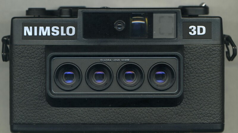 Nimslo 3D film camera with four-lens array and textured black body.