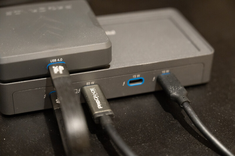 Close-up of USB cables and power adapters connected to external hard drives and hub devices.