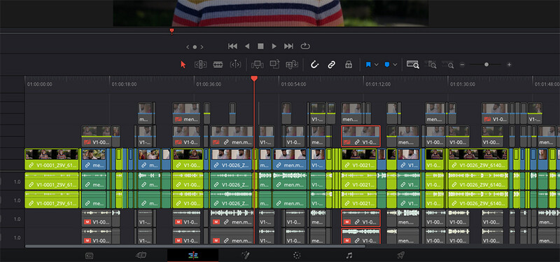 Screenshot of video editing timeline with multiple colored clips and audio tracks.
