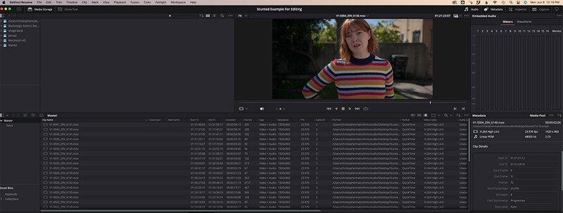 Screenshot of video editing software showing a portrait clip of a person wearing a colorful striped sweater.