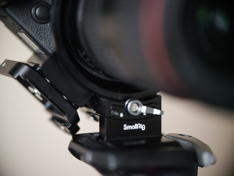 SmallRig shoulder rig accessory mounted on camera with lens attached.