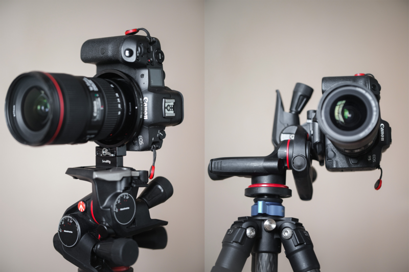 Two professional video cameras mounted on tripod heads with fluid pan-tilt mechanisms and red accent details.