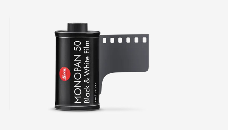 Leica Monopan 50 black and white film canister with sprocket holes visible on the right edge.
