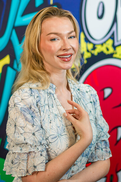 Model in front of a wall covered in graffiti