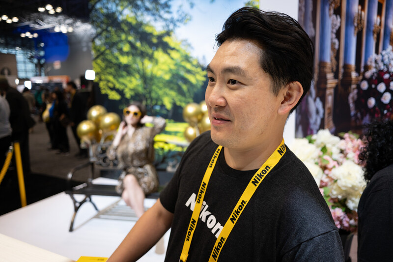 Man wearing a Nikon shirt