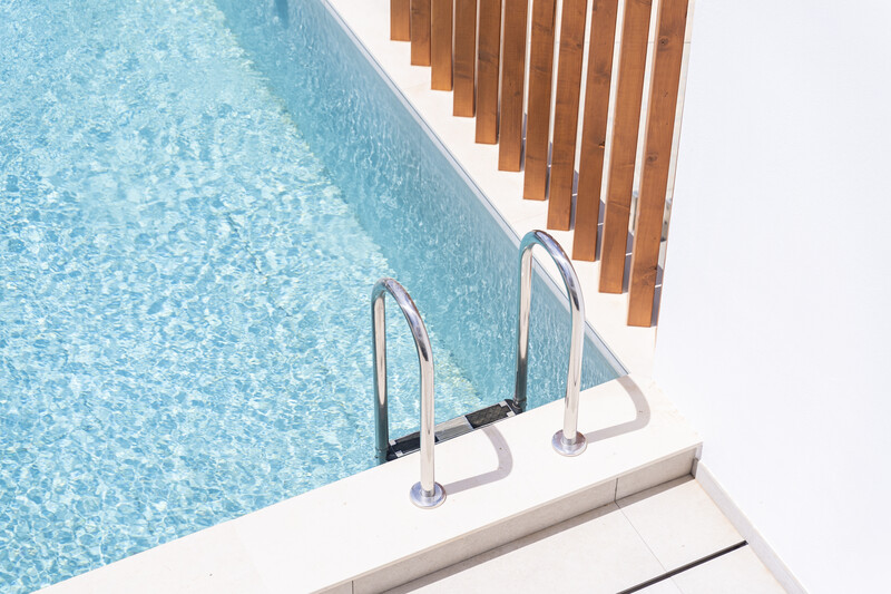 Swimming pool edge in bright sunlight