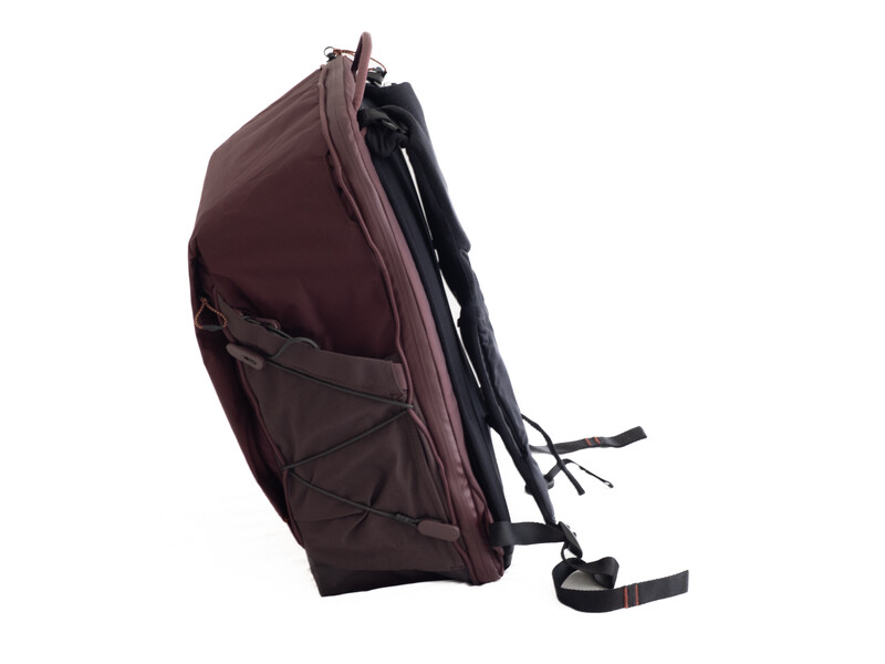 Burgundy backpack with padded straps shown in profile view against white background.