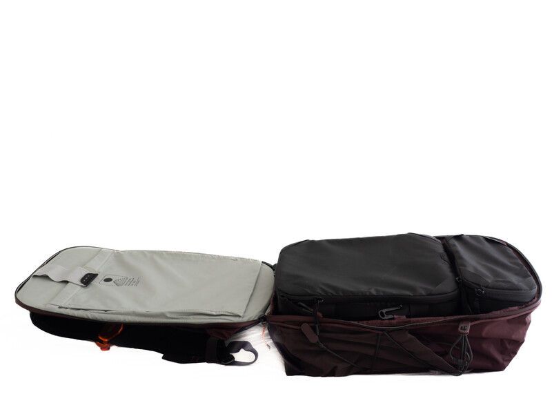 Two black equipment cases with gray and burgundy interior padding shown open side by side.