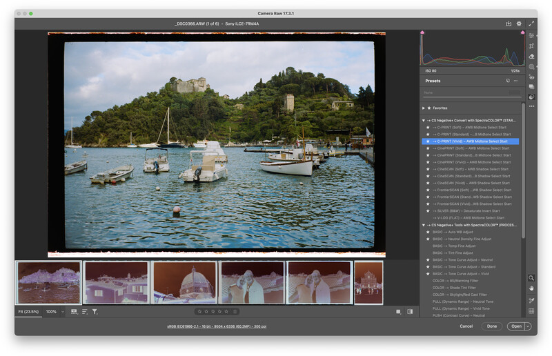 Screenshot of photo editing software displaying a coastal harbor image with boats and hillside ruins.