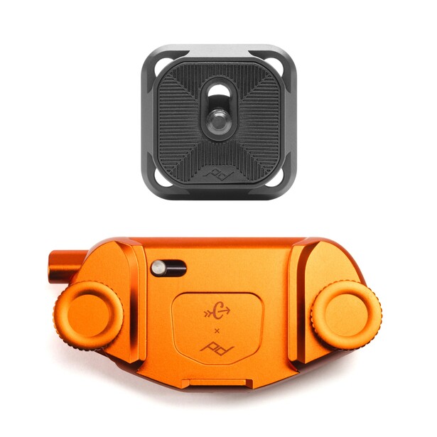 Thermal imaging camera with compact design and black textured top plate and bright orange body.