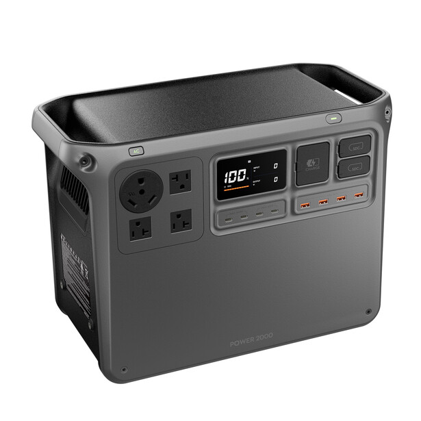 Portable power station with digital display, AC outlets, and USB ports on front panel.