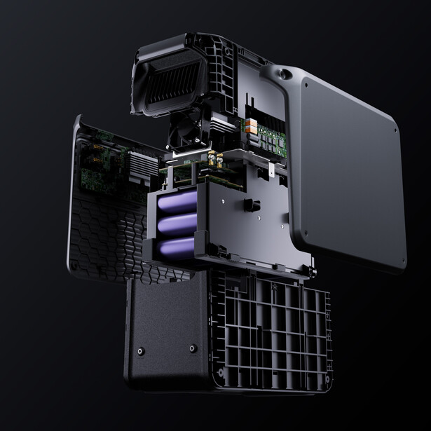 Exploded view of a compact computer case showing internal components including power supply, cooling system, and motherboard layout.