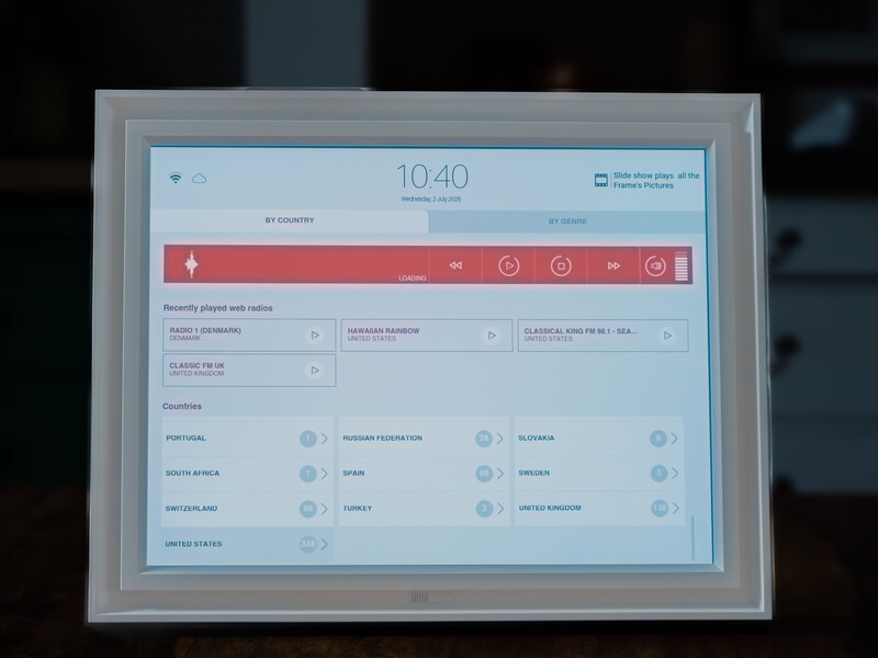 Screenshot of a digital control panel interface with a red header bar and organized menu options displayed on a tablet screen.