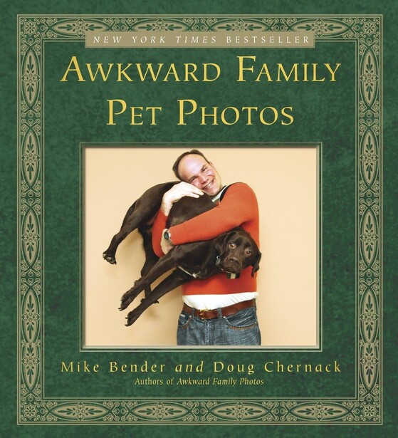 Book cover for "Awkward Family Pet Photos" featuring a person holding two dogs in an awkward pose.