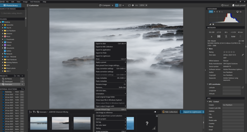 Screenshot of photo editing software showing a long-exposure seascape with rocky coastline and smooth water.