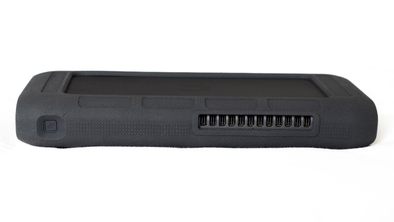 Dark gray protective case with textured grip surface and vented cooling slots along the side.