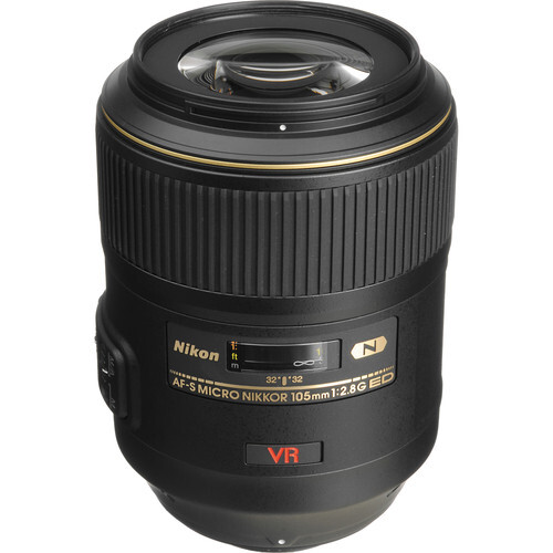 Nikon AF-S VR macro telephoto lens with gold accents and vibration reduction marking.