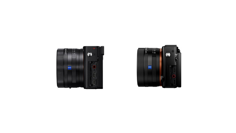 Side-by-side comparison of two compact mirrorless cameras with attached prime lenses.