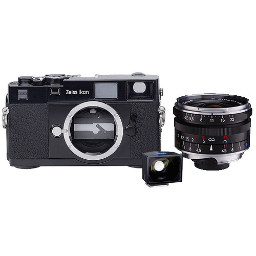 Zeiss Ikon rangefinder film camera body with Zeiss Ikon lens and external light meter accessory.