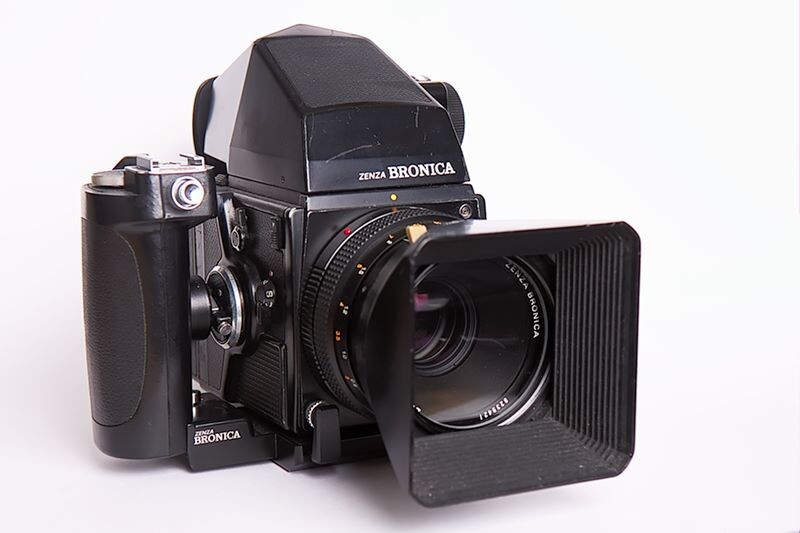 Zenza Bronica medium format SLR camera with lens and bellows-style lens hood attached.