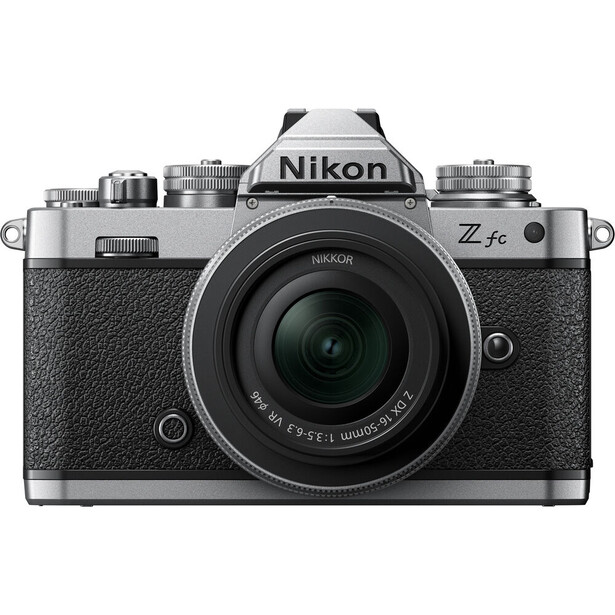 Nikon Z fc mirrorless camera with 28mm f/2.8 lens, front view against white background.