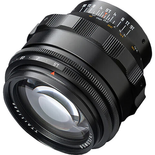Black cinema lens with focus ring and aperture markings visible against white background.