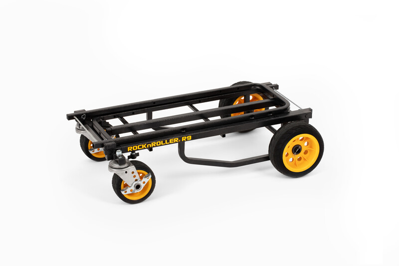 Black and yellow folding hand truck with pneumatic wheels and pull handle.