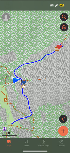 Screenshot of a mapping application displaying a blue route line connecting multiple waypoints across a green and gray landscape.