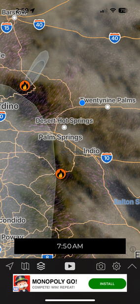 Screenshot of a mobile map interface displaying a geographic area with fire incident markers and road networks.